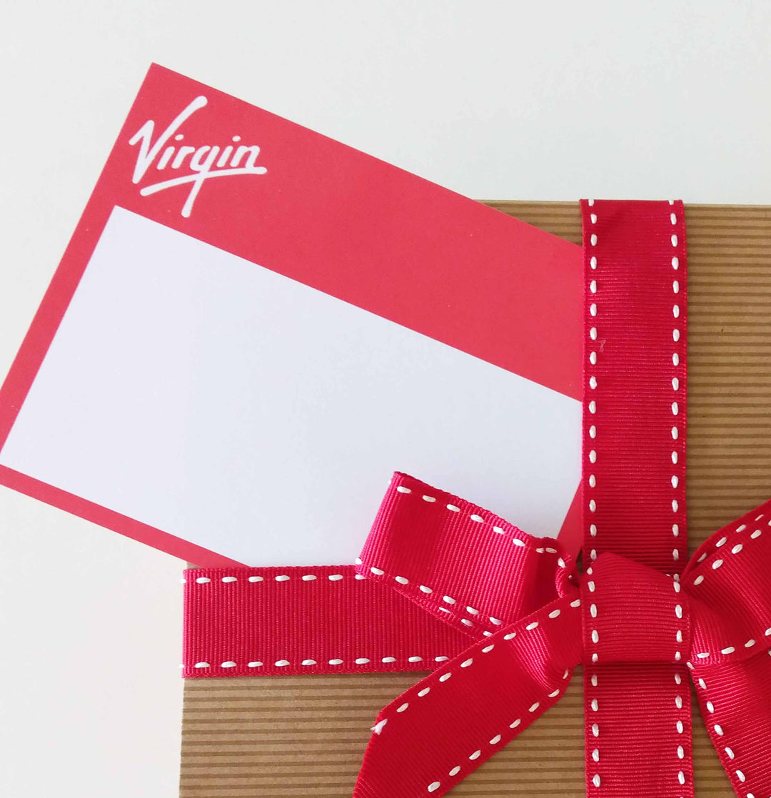 Gift box with a red ribbon and Virgin logo on a white background