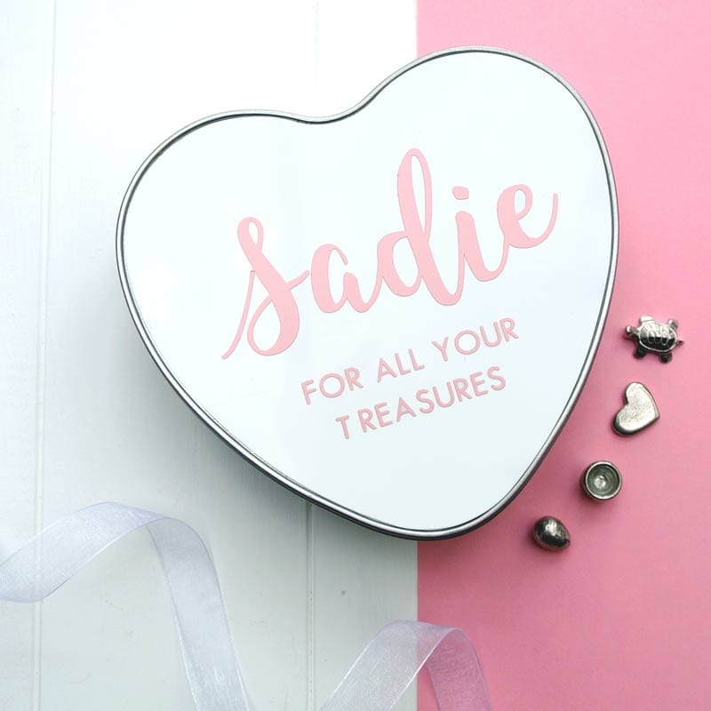 This baby name heart shaped tin makes a really unique personalised gift. Perfect for a new baby, baby shower or Christening gift. Keep your baby’s special memories and keepsakes safe, and add your new little one's name to our Personalised Baby Heart Box. Perfect for special cards, hospital bracelets or their first lock of hair. Print in Pink. Our keepsake tins not only look great in any modern nursery, but they make a perfect keepsake to keep precious items safe for years and years.