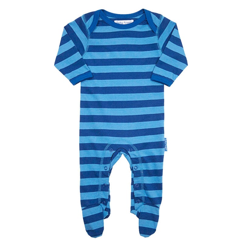 Stand out from the crowd with this funky sleep suit from designer brand Toby Tiger just for little boys.  100% super soft organic cotton, with bright blue stripe design for boys. Gorgeous thick fabric to keep baby warm.  Beautifully designed and produced by designer baby brand Toby Tiger.  Features popper bottom.  Age 0-3 months.