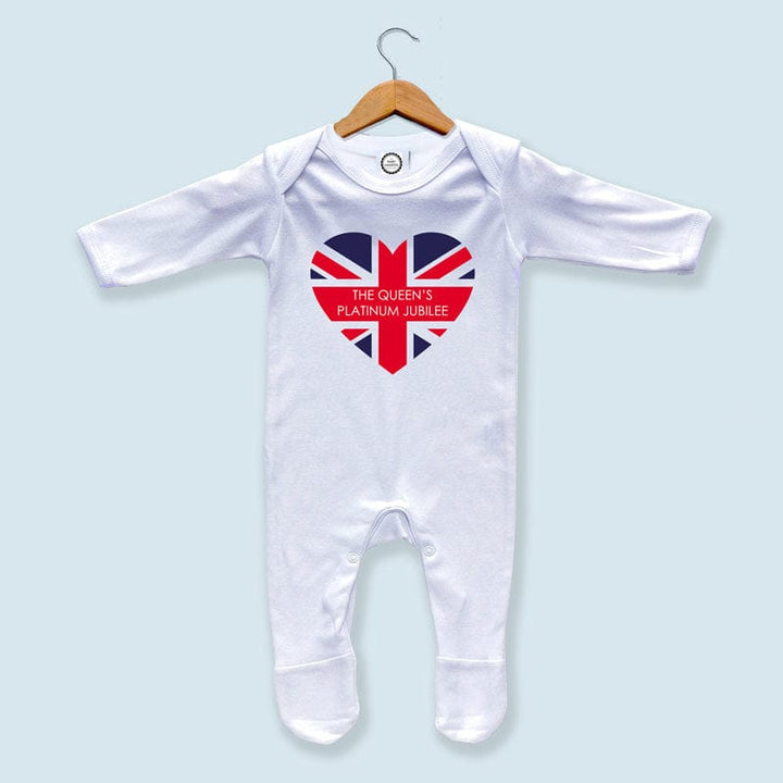 Give your newborn a piece of royal history with this Queen's Jubilee 2022 Baby Sleepsuit. Made from 100% cotton, this soft and comfortable sleepsuit is perfect for little ones to wear during nap time or bedtime. The envelope neckline and popper fastening make it easy to put on and take off, while the Union Jack design pays tribute to the Platinum jubilee in 2022.