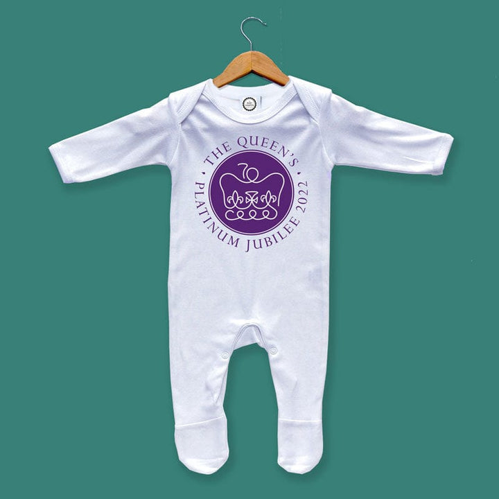 Looking for a special baby outfit to commemorate Queen's Platinum Jubilee 2022? Look no further than this adorable baby sleepsuit! Made from 100% cotton, this sleepsuit is both comfortable and stylish. It features an envelope neckline and popper fastening, making it easy to put on and take off. Plus, the purple Jubilee emblem makes it a perfect keepsake of a national celebration in 2022!