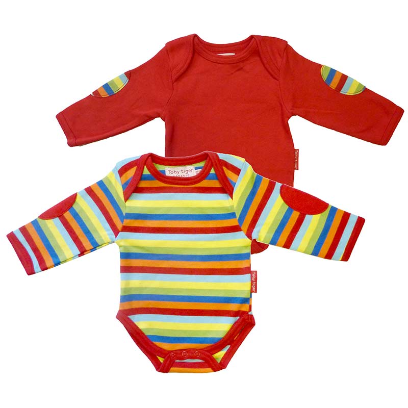 A twin pack of super soft 100% cotton Toby Tiger baby t shirts. One in stripe print and the other in contrast plain red, both with arm patch detailing.  Ideal for adding to a baby hamper for a baby shower as a suitable for a boy or girl.  Features envelope neckline and popper fastenings to underneath, for super speed baby changing.   Age 0-3 months.