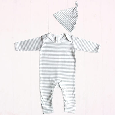 A beautiful grey and white stripe print baby outfit set suitable for a boy or girl. Includes a 100% cotton sleep suit (0-3 months) and 100% cotton knotted hat (age 0-6 months).  Exclusively designed and manuf