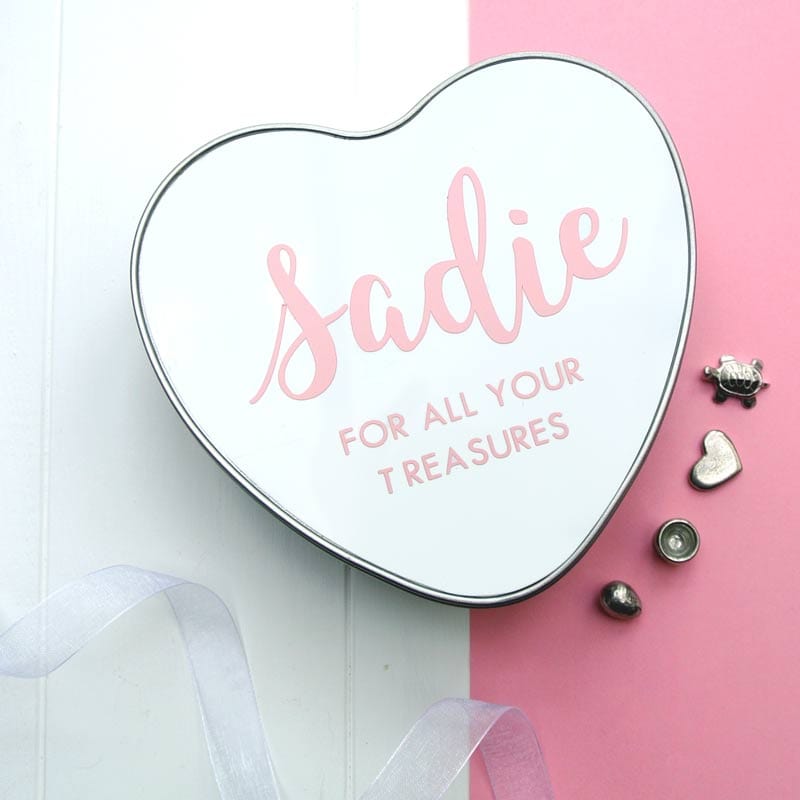 This baby name heart shaped tin makes a really unique personalised gift. Perfect for a new baby, baby shower or Christening gift.  Keep your baby’s special memories and keepsakes safe, and add your new little one's name to our Personalised Baby Heart Box. Perfect for special cards, hospital bracelets or their first lock of hair.   Print in Pink.  Our keepsake tins not only look great in any modern nursery, but they make a perfect keepsake to keep precious items safe for years and years. 