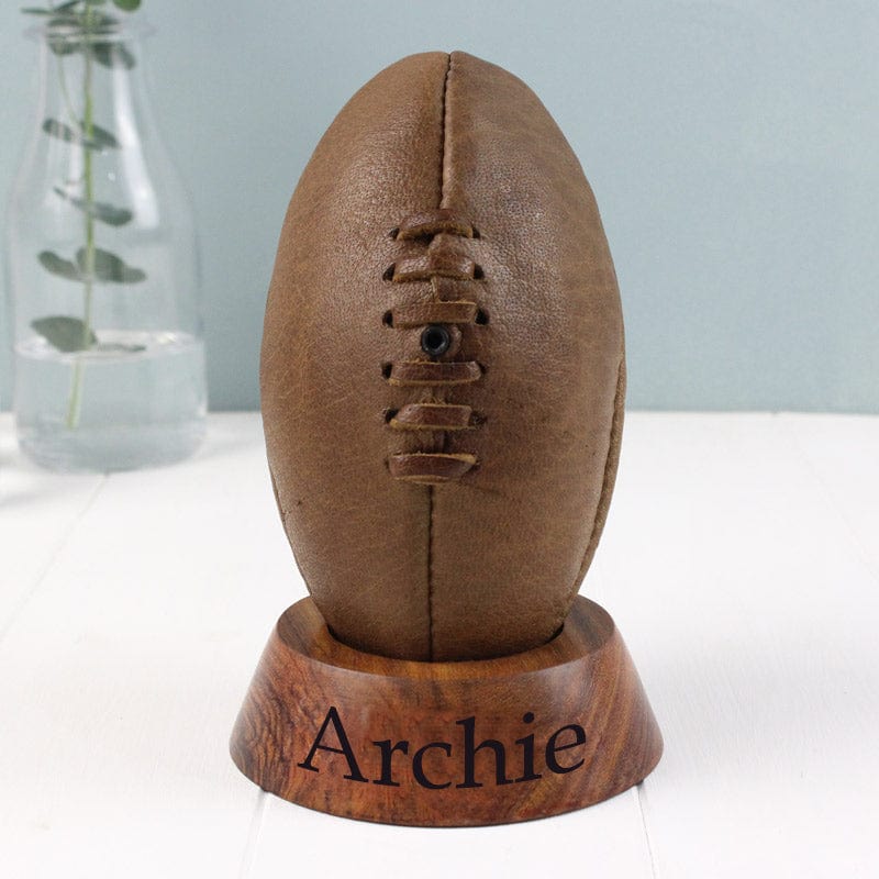 Then what a better gift to get a little one than this personalised rugby ball!  A unique and classic vintage rugby ball in wooden stand that makes a perfect Christening or new baby keepsake gift!